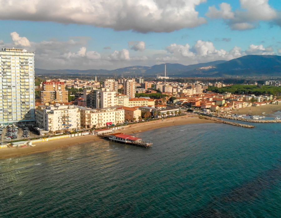 Panoramic aerial view of Follonica, Italy. Coastline of Tuscany with town and ocean.